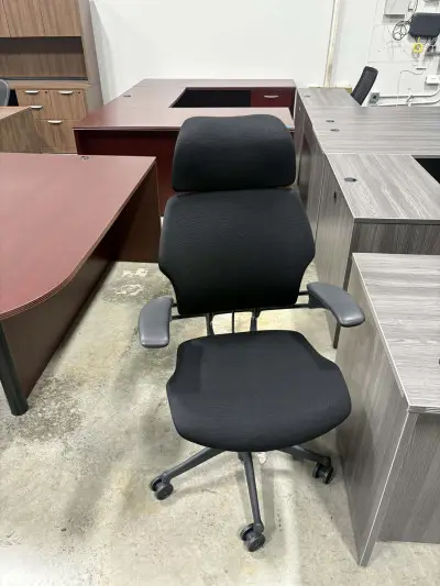 Preowned HumanScale Freedom black chair with headrest at Peach State Office Furniture, Atlanta