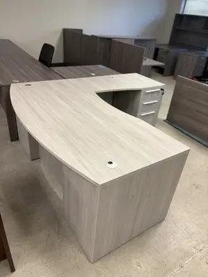 Brand new Bowfront Dove Oak L shaped desk with deluxe drawers at Peach State Office Furniture, Atlanta